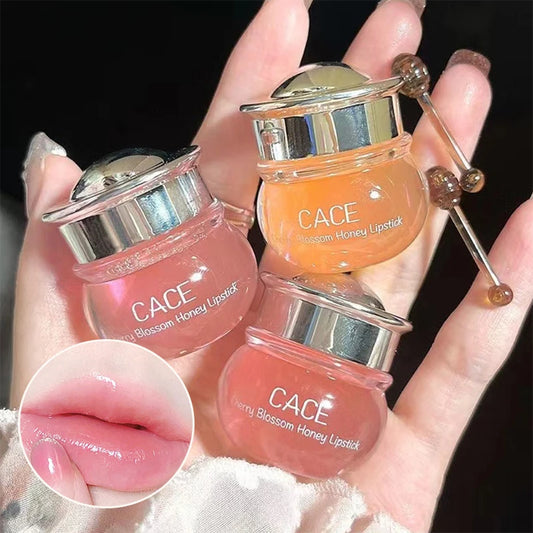 Three lip balms held in a hand, with close-up of a pink lip.